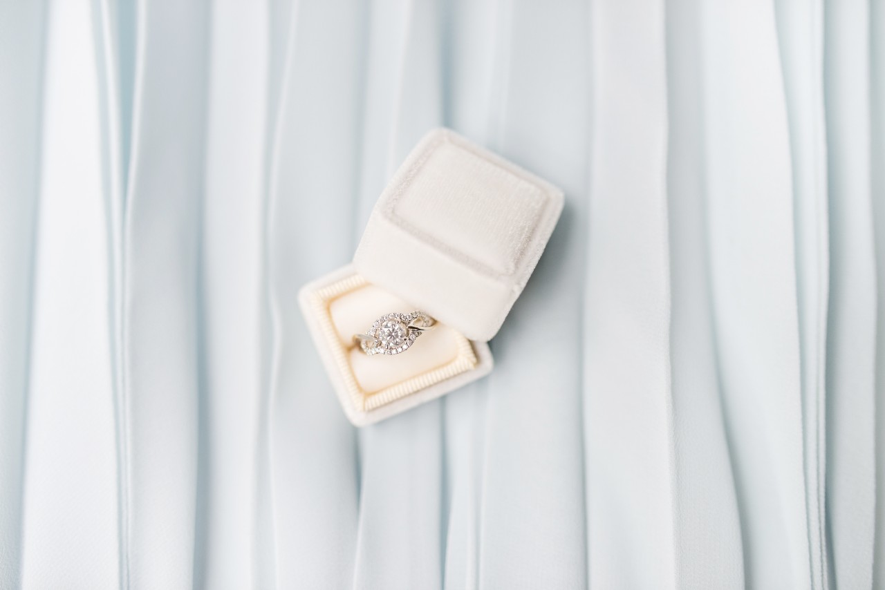 Glamorous engagement ring with a diamond halo setting