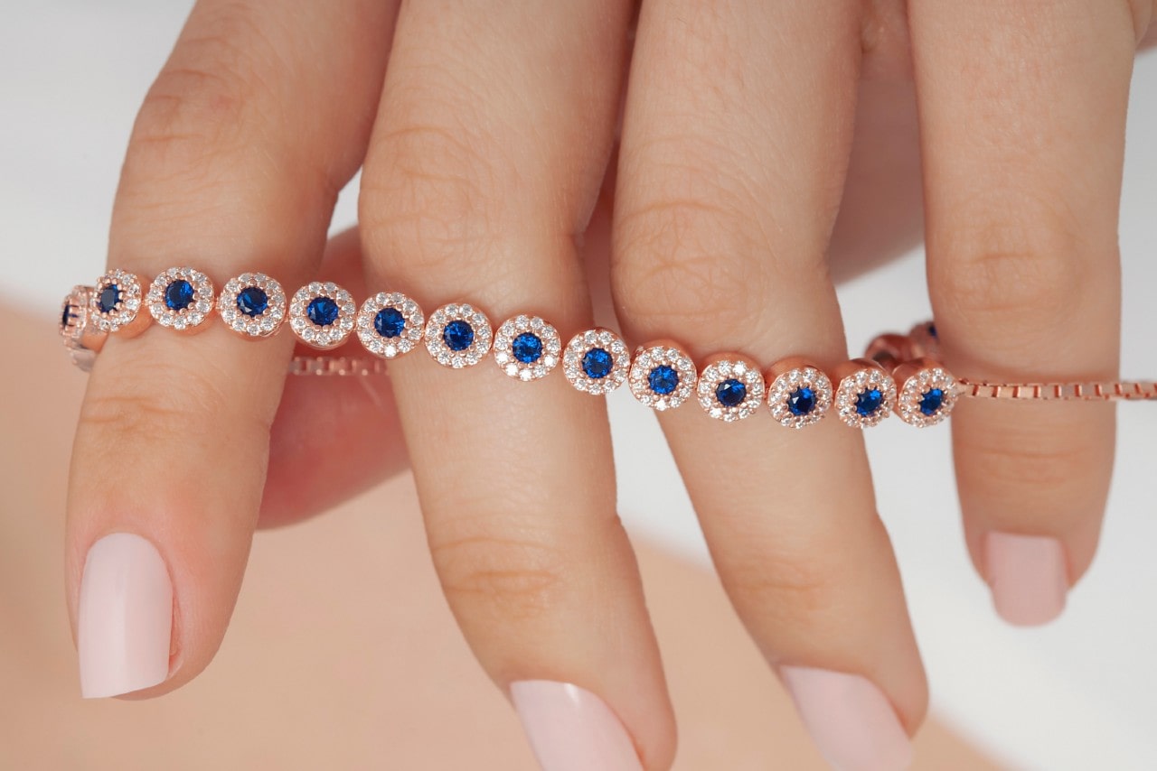 Rose gold line bracelet with sapphires and diamond accents