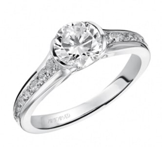 a bezel-set engagement ring with channel-set side stones from ArtCarved.