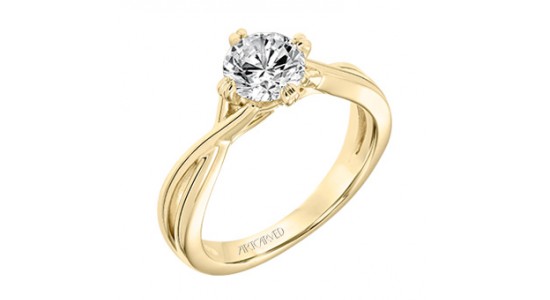 a yellow gold solitaire engagement ring with a round cut center stone