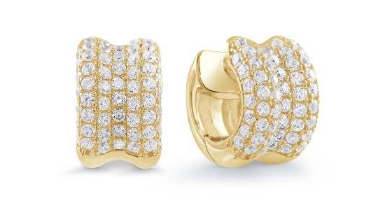 a pair of diamond-studded yellow gold huggie earrings