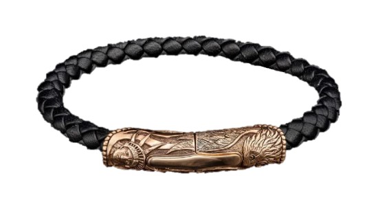 a black leather bracelet with a carved bronze piece