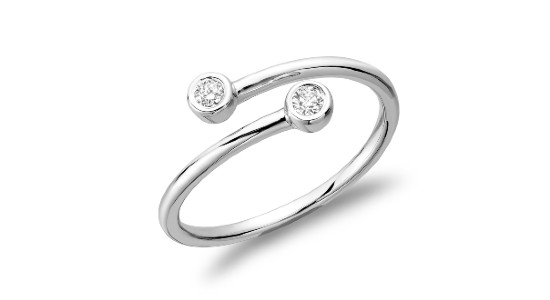 a silver fashion ring with two bezel set diamonds