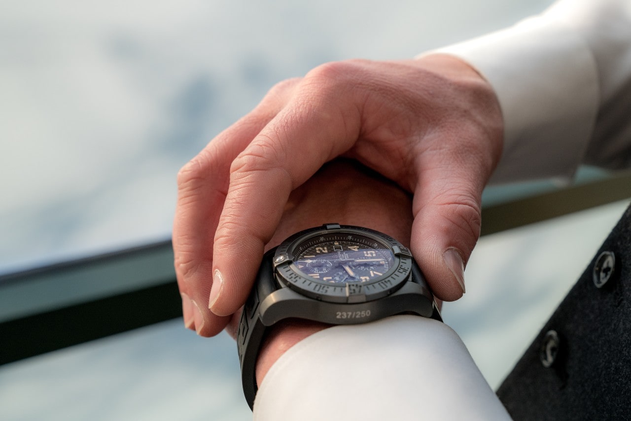 A close-up of a man checking the sports watch on his wrist.