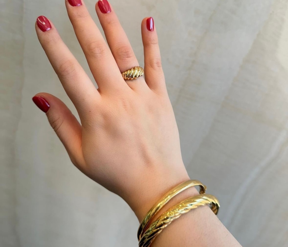 Gold stackable bracelets at Damiani Jewellers in Woodbridge, Ontario.