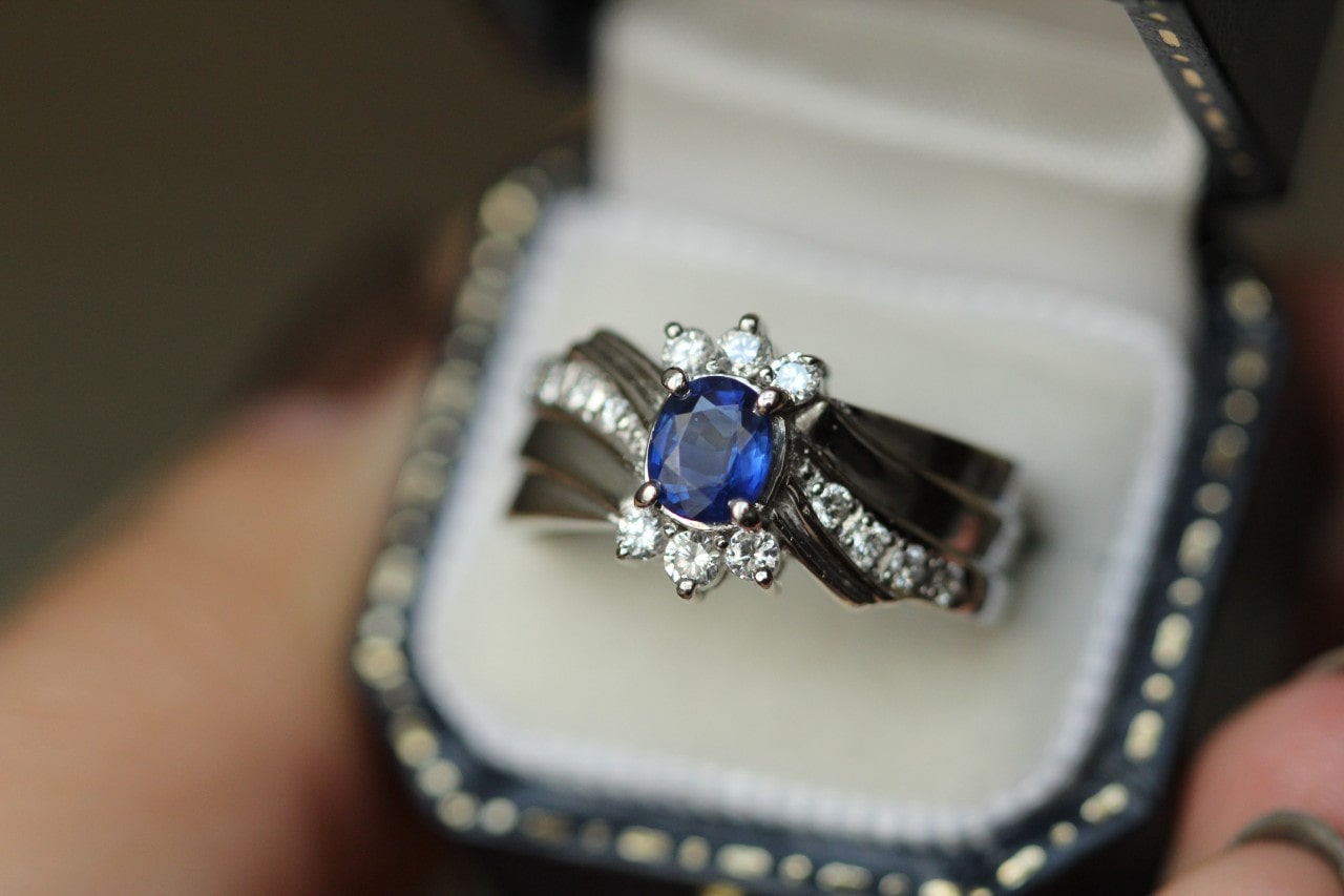 A complex sapphire ring in a luxurious ring box
